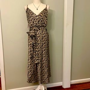 Stunning animal print satin sundress with elastic waist, straps & self tie belt!